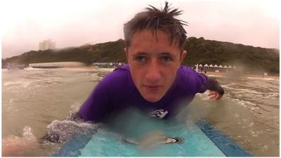 Brandon surfing on the Dorset coast