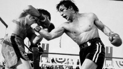 Ray 'Boom Boom' Mancini throws a punch in a bout with Deuk-Koo Kim in a 1982 title fight in which Kim later died