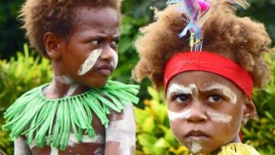 Two children celebrate the Queen's Baton Relay arrival in Papua New Guinea