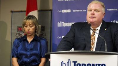 Toronto Mayor Rob Ford speaks at a news conference with his wife Renata at City Hall in Toronto, on 14 November 2013