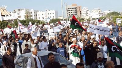 Protesters march during a demonstration calling on militiamen to leave, in Tripoli November 15, 2013