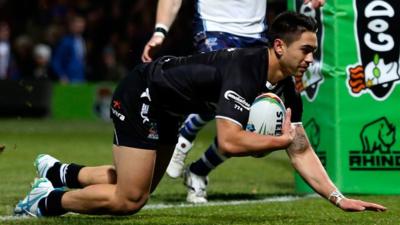 Shaun Johnson of New Zealand dives over to score a try against Scotland at Headingley