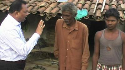 A local administrator talks to Sherdand's two voters