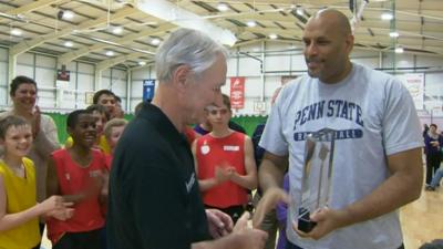 Joe Forber accepts his award from John Amaechi