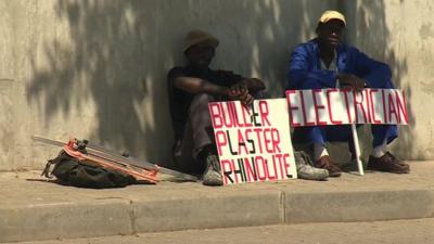 Job hunters with placards