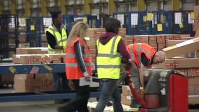 People sorting parcels