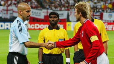 Juan Sebastian Veron and David Beckham shake hands before Argentina v England at the FIFA World Cup in 2002