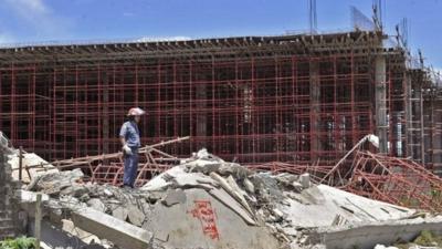 Police officer at site of mall collapse