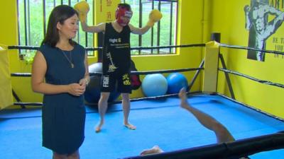 Linda Yueh in boxing ring