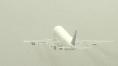 The airborne Boeing 747 Dreamlifter cargo plane