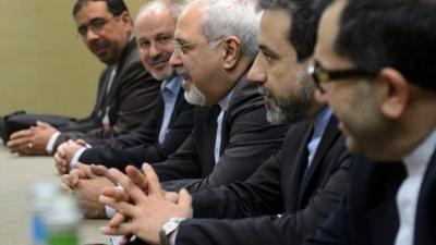 Iranian Foreign Minister Mohammad Javad Zarif, center, attends talks on Iran"s nuclear program in Geneva on Friday Nov. 22, 2013