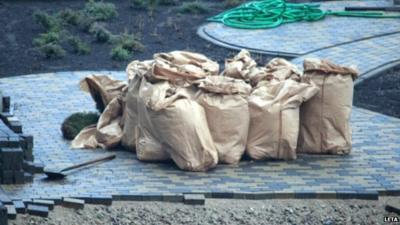 Piles of building material on supermarket roof