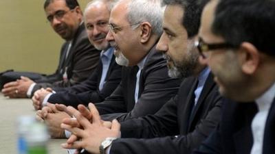 Iranian Foreign Minister Mohammad Javad Zarif, center, attends talks on Iran"s nuclear program in Geneva on Friday Nov. 22, 2013