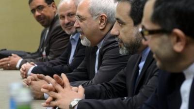 Iranian Foreign Minister Mohammad Javad Zarif, centre, attends talks on Iran's nuclear program in Geneva on Friday Nov. 22, 2013