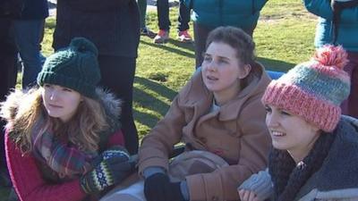 Freya Barlow and two friends watch the skydive