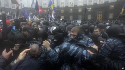 Protesters and police scuffle