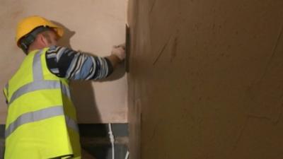 Man plastering wall