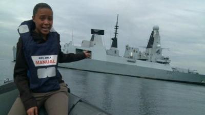 Leah Gooding in front of HMS Daring