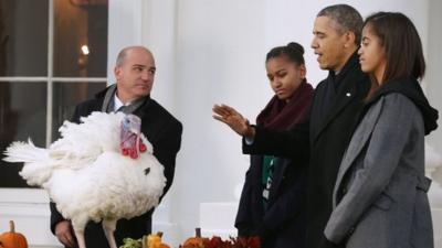 President Barack Obama, with daughters Malia (right) and Sasha, pardoned a turkey at the White House in Washington DC on 27 November 2013