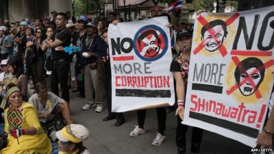 Protesters rally in front of the national police headquarters in Bangkok