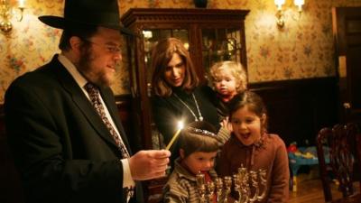 A Rabbi celebrating Hanukkah with his family