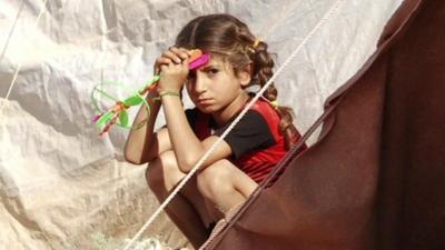 A girl in a refugee camp in Syria