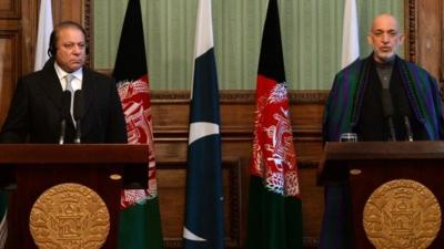 Afghan president Hamid Karzai (R) speaks during a joint press conference with Pakistani Prime Minister Nawaz Sharif