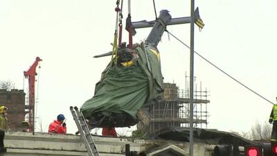 Helicopter being removed