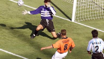 Dennis Bergkamp scores for Netherlands against Argentina at the 1998 World Cup
