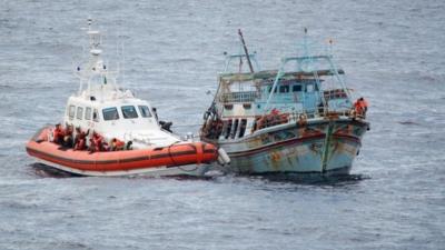 Coastguard rescues migrants off boat near Italy