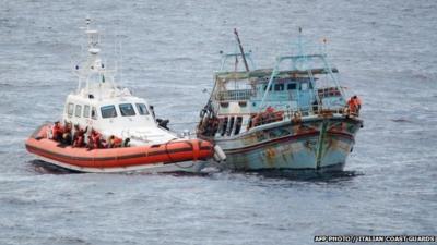 Coastguard rescues migrants off boat near Italy