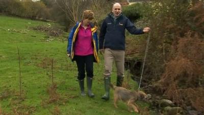 Rob and Marcel Smith walk their dog