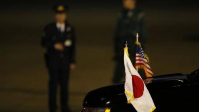 National flags of Japan and US on car carrying US Vice-President Joe Biden