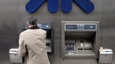 man using RBS cashpoint