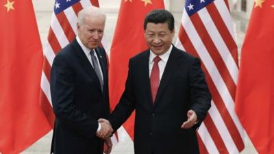 Chinese President Xi Jinping (R) shakes hands with U.S. Vice President Joe Biden (L) on 4/12