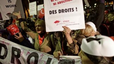 Sex workers attend a protest demonstration after French deputies voted for a reform of prostitution law in Paris December 4, 2013