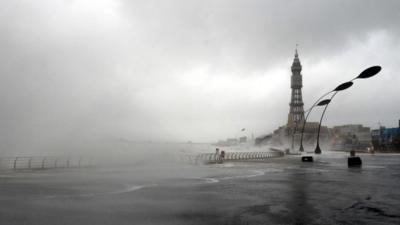 The tide comes over the sea wall in Blackpool, north west England, on December 5, 2013