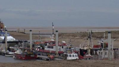 Fishing boats moved to the outer harbour at Wells-next-the-Sea