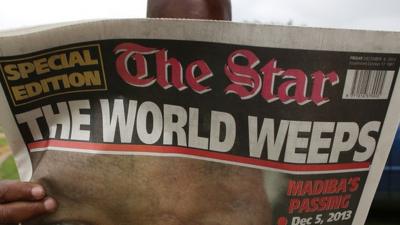 Newspaper headline announcing Mandela death