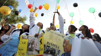 Young South Africans release 95 balloons representing the 95 years of life enjoyed by former President Nelson Mandela