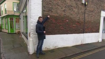 BBC reporter Ed Thomas points out how high the tidal surges were in Boston, Lincolnshire