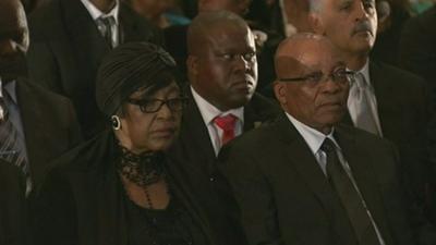 Winnie Mandela and President Jacob Zuma attend a memorial service for Nelson Mandela