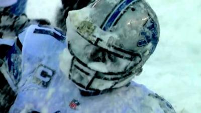 Detroit Lions' Calvin Johnson gets a face full of snow