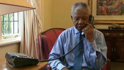 archive picture of Nelson Mandela making phone call