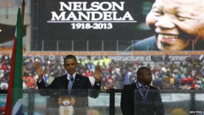 President Barack Obama addresses the crowd during a memorial service for Nelson Mandela at FNB Stadium