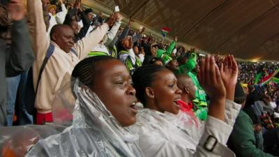 A crowd cheering