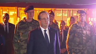 The President of France, Francois Hollande, inspecting coffins of French soldiers