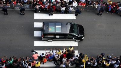 The body of former South African president Nelson Mandela is transported to the Union Buildings on December 11