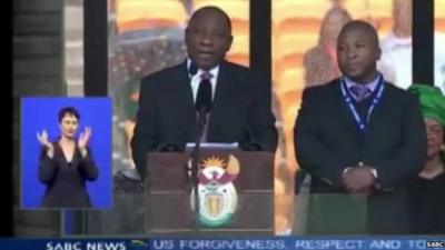 Still from SABC TV of two sign language interpreters