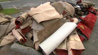 Discarded carpets after flooding in Barton-upon-Humber